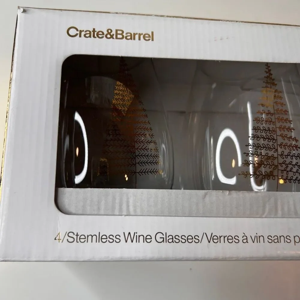 Crate & Barrel boxed set of 4 stemless wine glasses featuring a holiday tree des